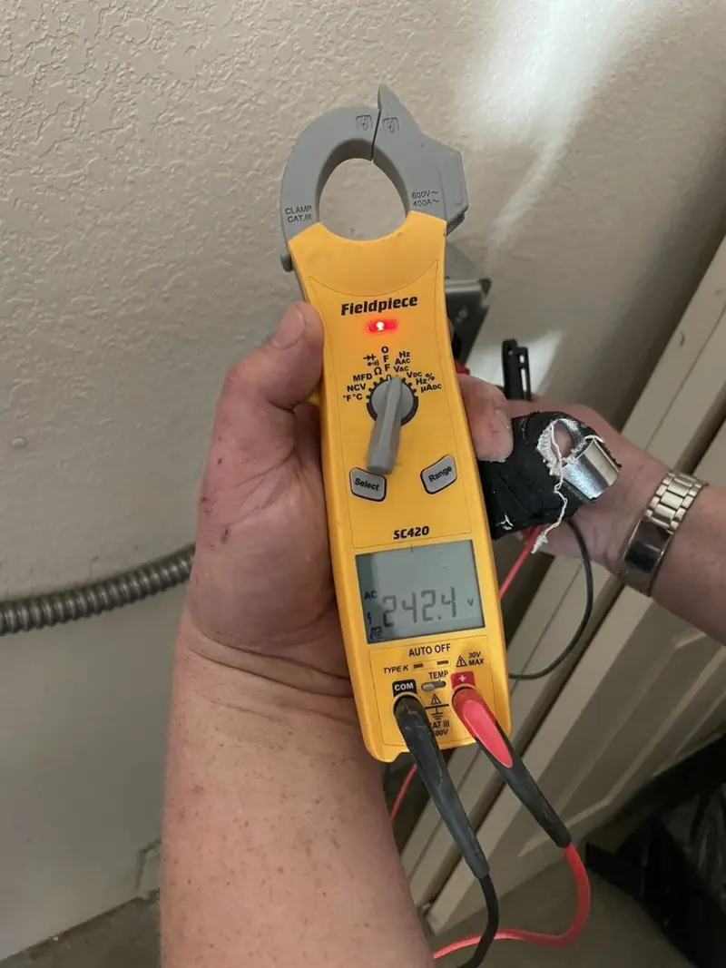 Voltage testing with clamp meter during Ceiling Fan Installation in Millersville